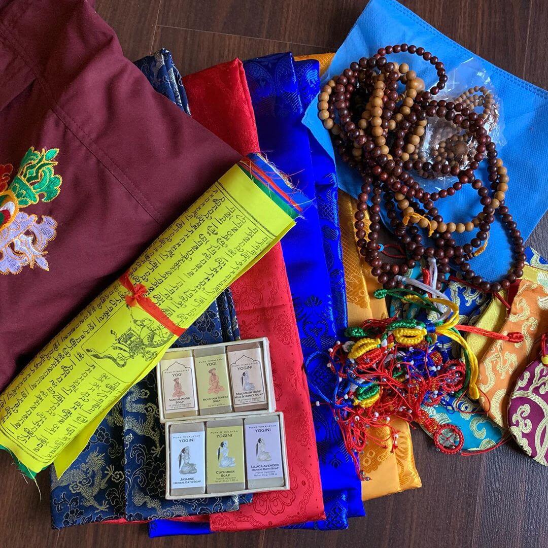 Essential dharma items like a kata, prayer flags, mala, Wild Earth yogi soap, journal and a dharma bag to carry everything
