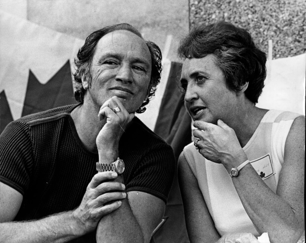 A black and white photograph of Pierre Elliot Trudeau and journalist Simma Holt.