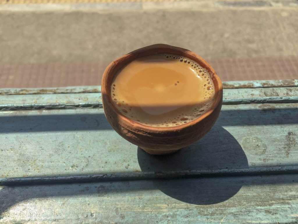 Cup of chai in a terracotta cup.